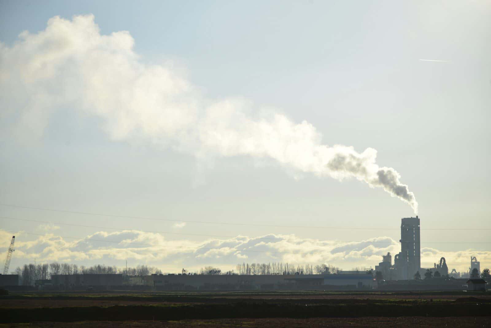 A factory with smoke coming out of it